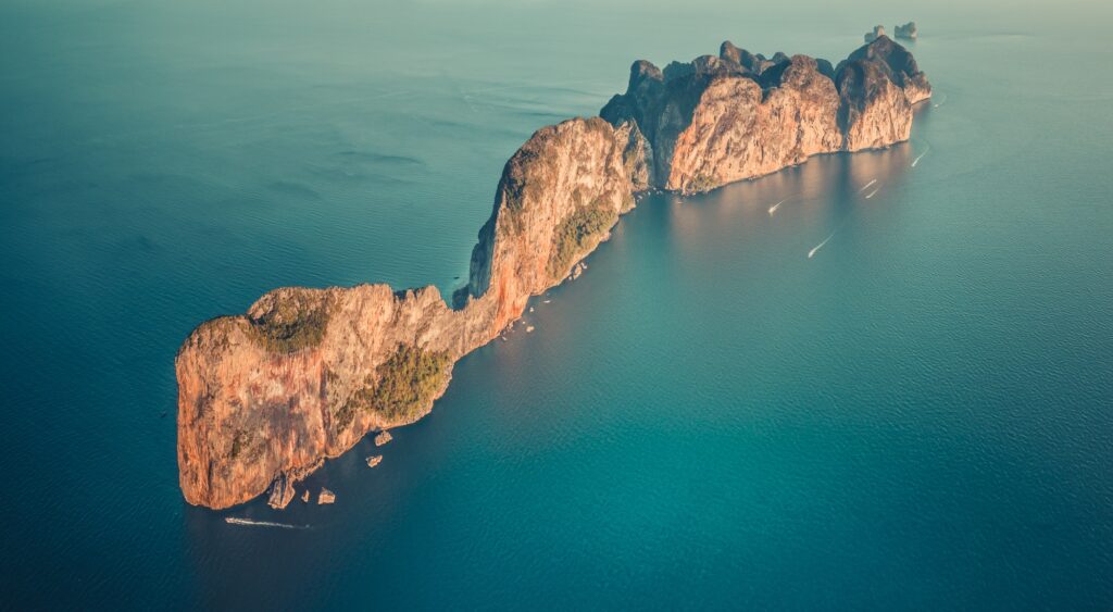 Aerial drone top view on lonley island in ocean